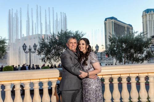 Photographers of Las Vegas - wedding photography - bride and groom posed with bellagio fountains