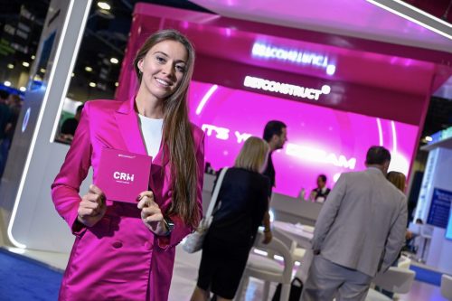 Photographers of las vegas - convention photography - woman in front of booth showing promotional material