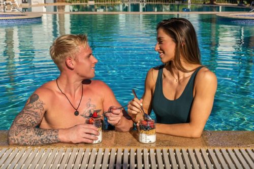 Photographers of Las Vegas - Product Photography - couple at the pool with measuring jars