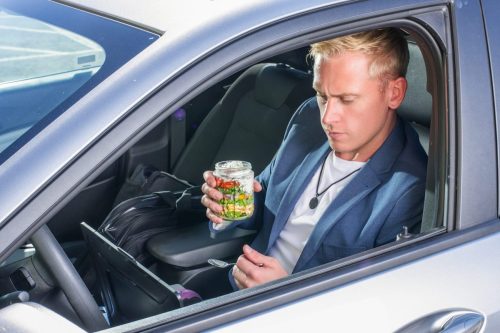 Photographers of Las Vegas - Product Photography - business male eating in car